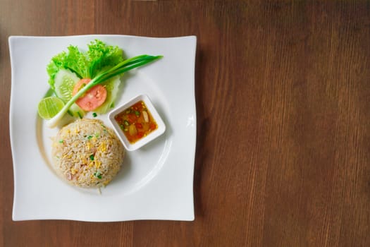 Fried rice on white plate, Thai street food.