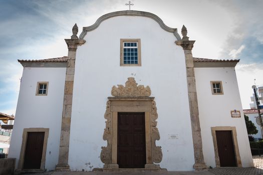 Albufeira, Portugal - May 3, 2018: architectural detail of the Church of Saint Sebastian (Igreja de Sao Sebastiao) in the city center on a spring day