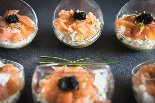 verrine salmon lumpfish egg fresh cheese and avocado bed in the kitchen