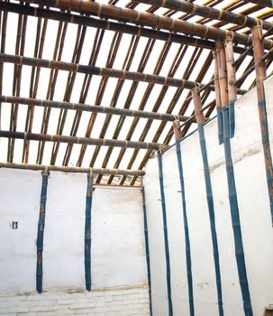 A traditional Chinese farmhouse made from bamboo poles and mud walls without nails
