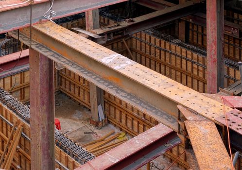 A large underground construction site with strong pillars and girders