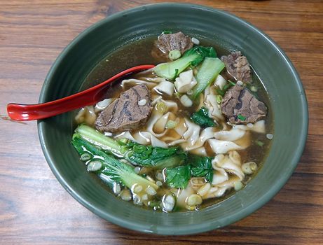 Braised chunks of beef in broth with noodles and chives is a popular dish in Taiwan