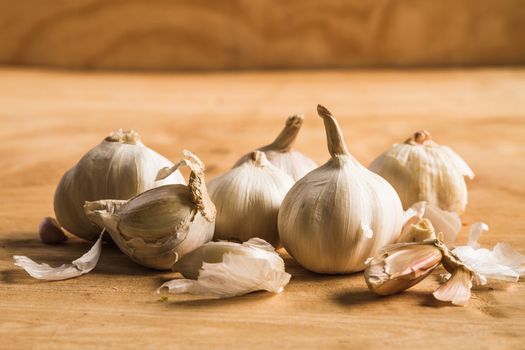 Fresh garlic on wooden table background.