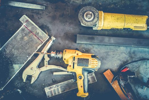 Many Tools on grunge table.View from above. Copy space.