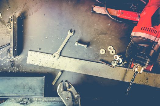 Many Tools on grunge table.View from above. Copy space.