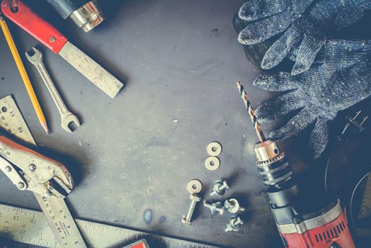 Many Tools on grunge table.View from above. Copy space.