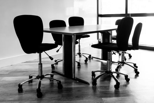 Table and chairs in a  conference room.black and white tone.