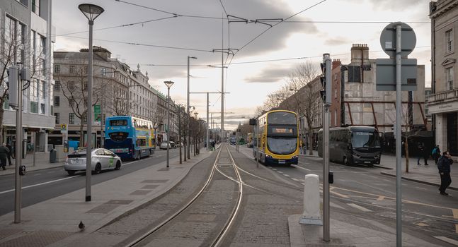 Dublin, Ireland - February 12, 2019: Typical Irish double decker bus running with its passengers in the city center on a winter day