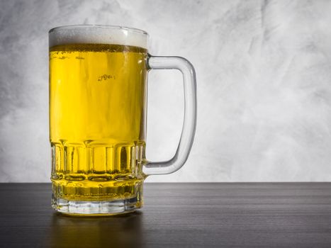 Glass of beer on a grunge background.