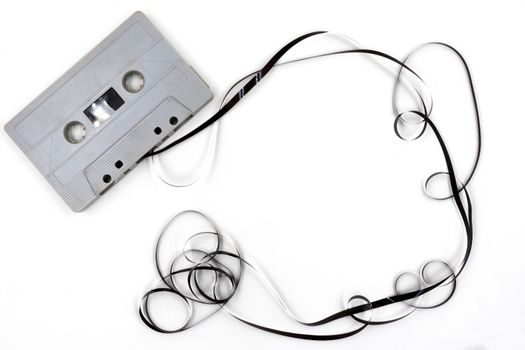 Old cassette tape on white background.