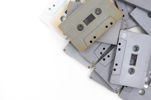 group of old cassette tapes on white background.