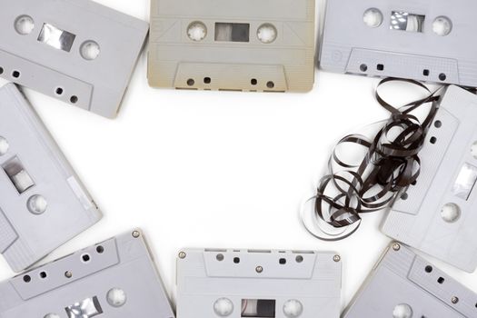 group of old cassette tapes on white background.