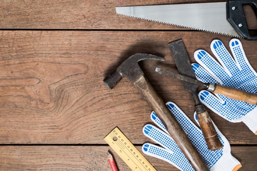 Many Tools on wooden table background.