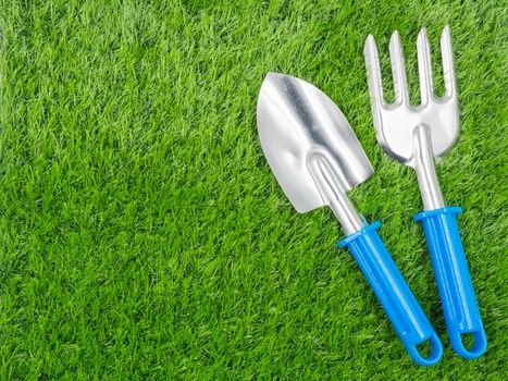 garden tools on grass background.