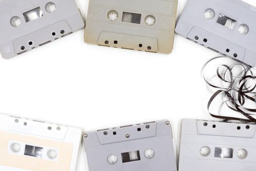 group of old cassette tapes on white background.