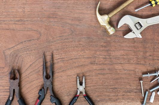 Many Tools on wooden table background.