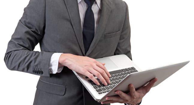 Businessman holding laptop isolated on white background.