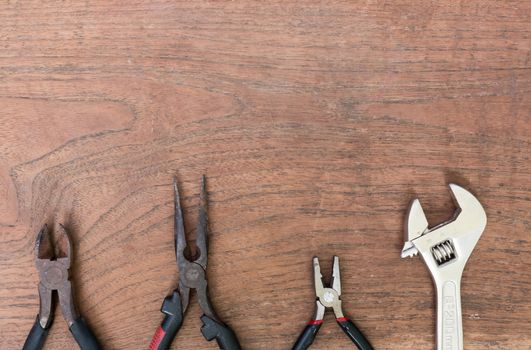 Many Tools on wooden table background.