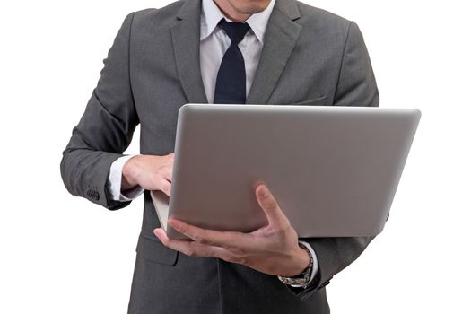 Businessman holding laptop isolated on white background.