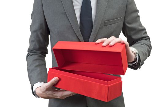 Businessman holding a red giftbox  isolated on white background.