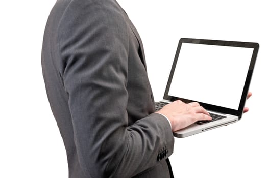 Businessman holding laptop isolated on white background.