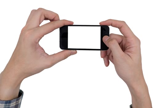 Male hands holding a mobile phone with touch blank white screen on white background.