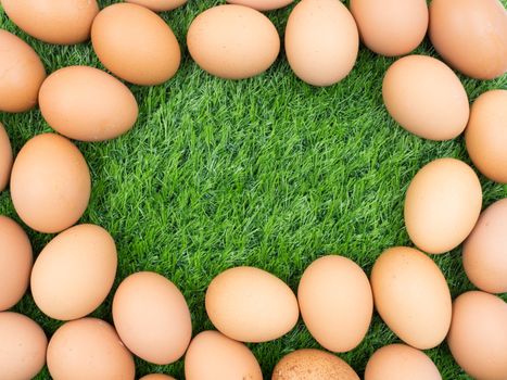 fresh eggs on grass background.