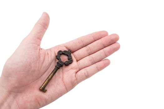 Male hand holding metal key on white background