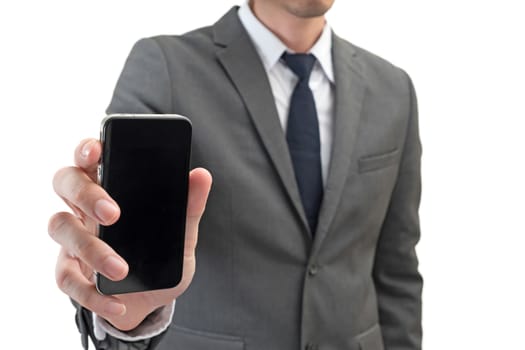 Businessman holding mobile phone  isolated on white background.