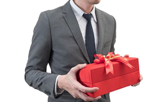 Businessman holding a red giftbox  isolated on white background.