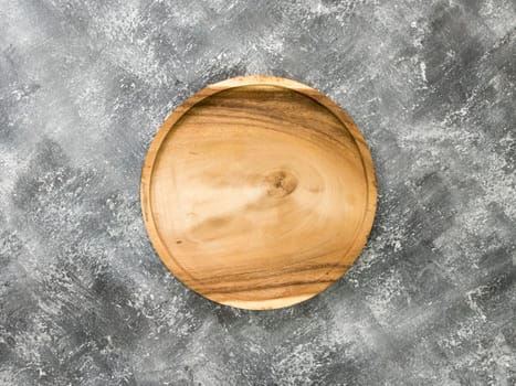 Top view of empty wooden tray on grunge  background.