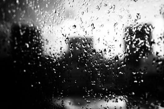 Raindrops on the glass window.black and white tone