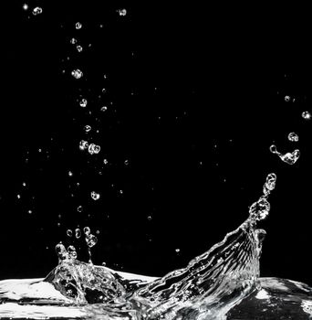 Water splash isolated on black background