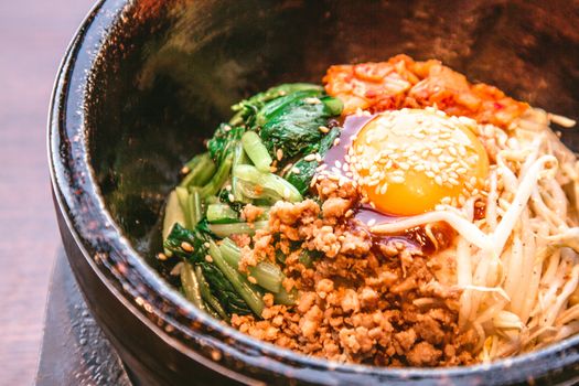 Bibimbap in a heated stone bowl, Korean food
