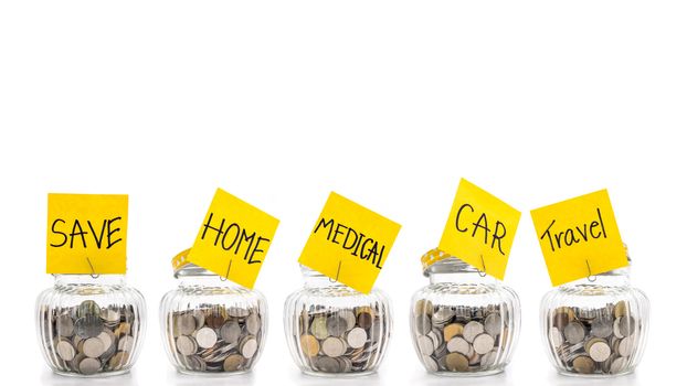 Coins in many glass bottles on white background, saving money concept