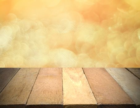 Empty wooden table in front of bokeh lights background.