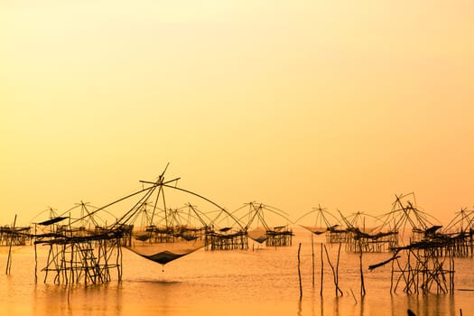 Landscape of square dip net or Yo(Thai language)made of bamboo in morning at Ban Pak Pra -Talay Noi Lake, Phatthalung, Thailand
