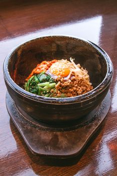 Bibimbap in a heated stone bowl, Korean food