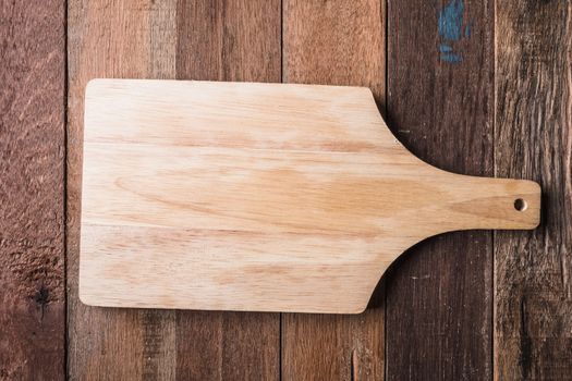 Top view of  wooden tray on wooden table background.