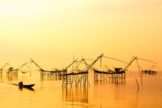 Landscape of square dip net or Yo(Thai language)made of bamboo in morning at Ban Pak Pra -Talay Noi Lake, Phatthalung, Thailand