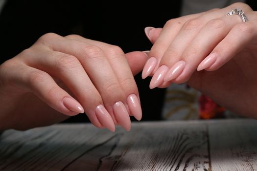 Multi-colored pastel manicure combined tone on tone with a striped background.