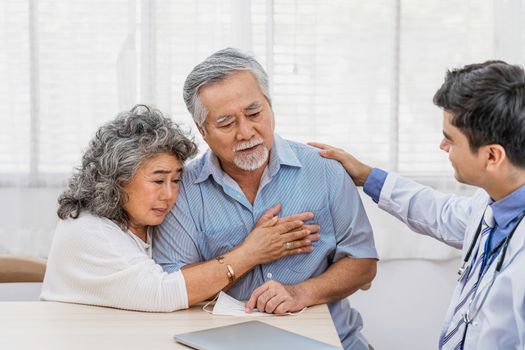 Doctor using stethoscope for auscultate Asian grandparent patient in house, service Life insurance at home, healthcare with Long live and Elderly society, Prevent epidemic concept