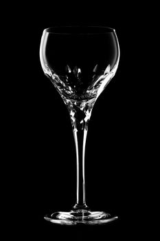 Glass of wine on black background.