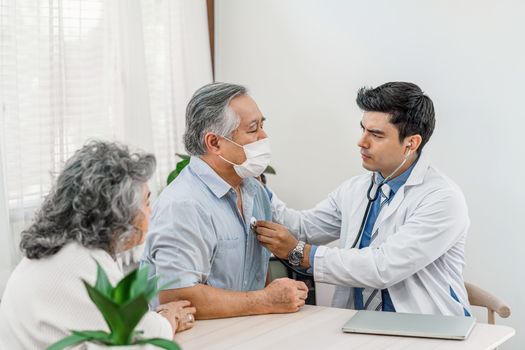 Doctor using stethoscope for auscultate Asian grandparent patient in house, service Life insurance at home, healthcare with Long live and Elderly society, Prevent epidemic concept