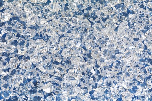 Ice cubes with blue and white light background cold