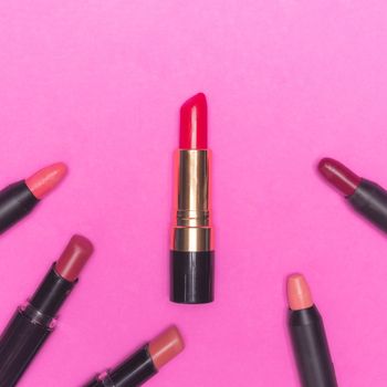 Lipsticks on pink background.  Makeup and Beauty concept