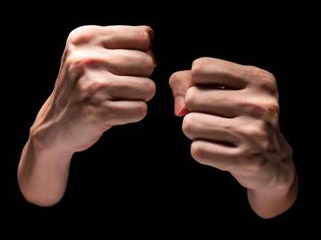 Male hands on a black background.