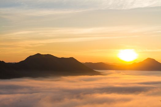 Beautiful landscape with mountains, mist and sun in the morning. Travel background.