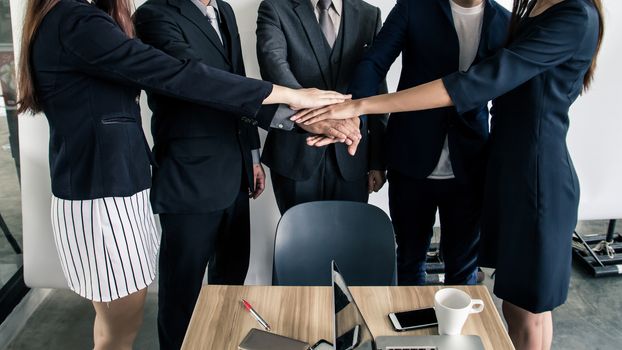 Business people joining hands together, success and teamwork concept.