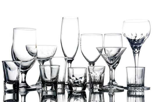 Collage of empty glasses on white background.